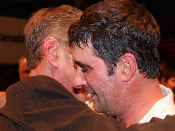 Brian and Rob Eby embrace