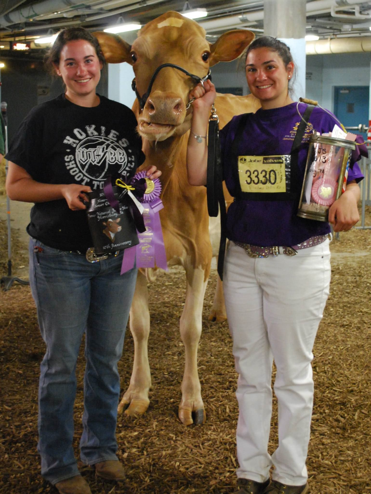 Cara and her sister Lauren at the All-American Dairy Show where Clara Bell was Reserve Grand Champion.