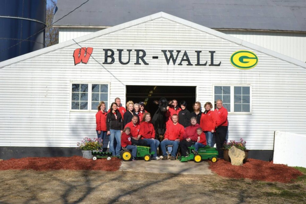 The members of Bur-Wall Holsteins pose with Bur-Wall Buckeye Gigi who was named the 2013 Star of the Breed. The crew is pictured (back row, from left) Lisa Behnke, Taylor Behnke, Roger Behnke, Morgan Behnke, Donna Behnke, Bob Behnke, Denise Behnke, Tori Evert, Tami Behnke, Brian Behnke; (front row, from left) Rebecca Murphy, Al Murphy, Brenda Murphy, Sterling Evert, Keri Evert, Carter Murphy. PHOTO BY RACHEL POMEROY