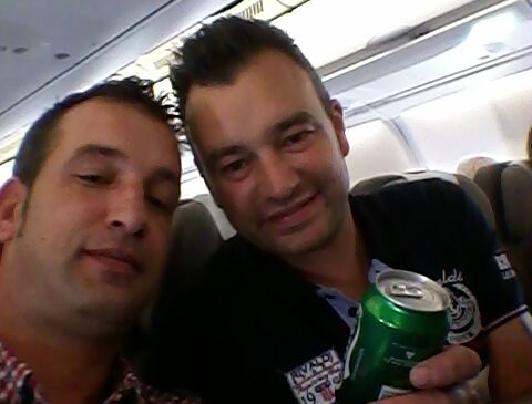 The life of a nomad is better with family. Alberto and his brother, Jose Medina, share a moment while en route to the World Dairy Expo in 2015, a rare bit of downtime in a schedule packed with international travel.